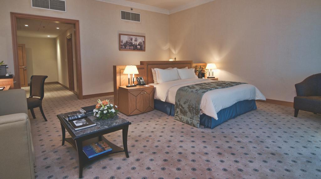 Wiseman Grand Hotel Doha Bagian luar foto A bedroom at the Grand Hyatt Hotel, Amman, Jordan